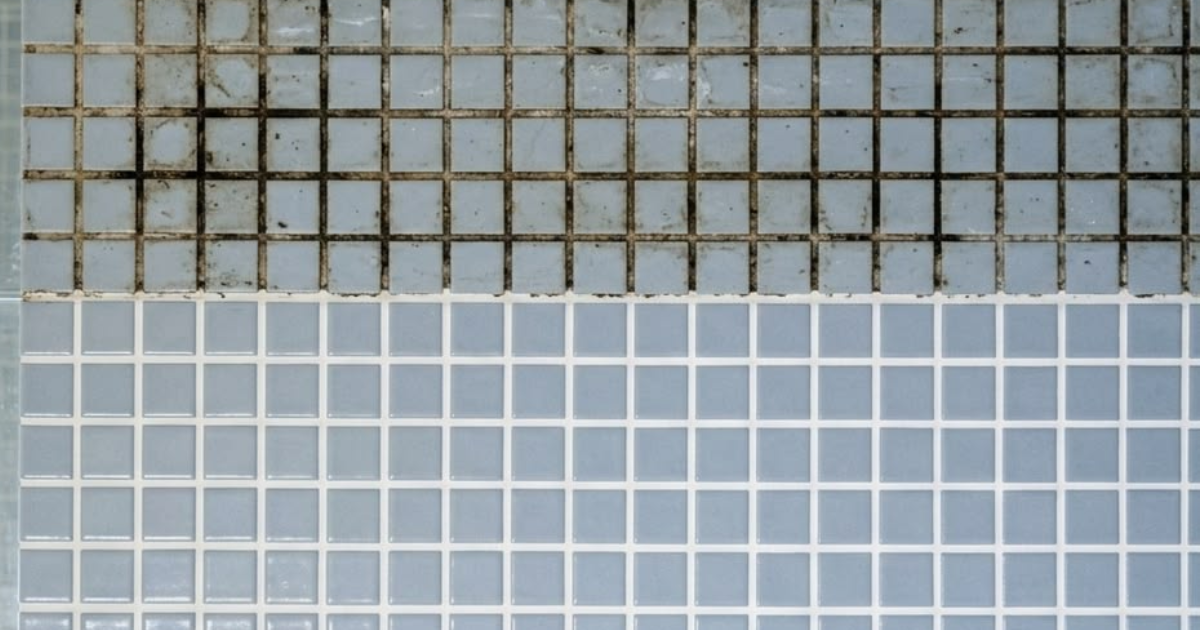 Black grout in shower showing mould and dark staining